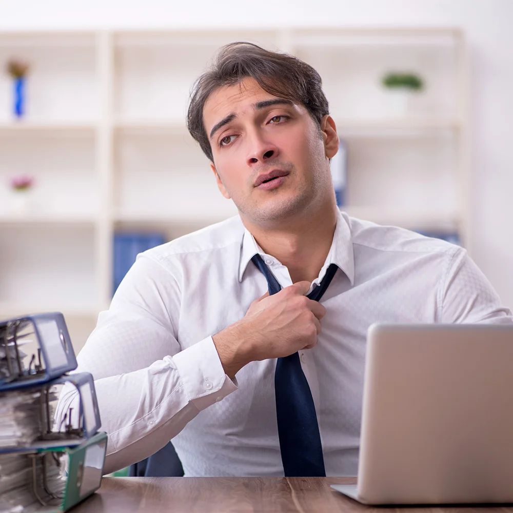Young office employee looking distressed